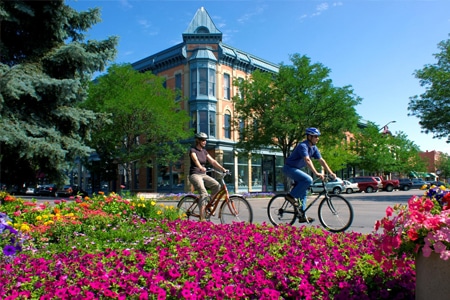 FortCollins-CO Building with cyclist and flowers